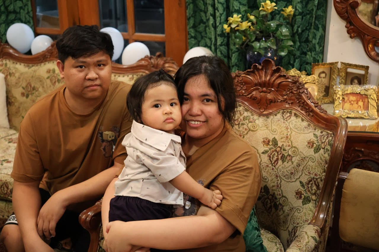 Isabelle with her husband and baby boy
